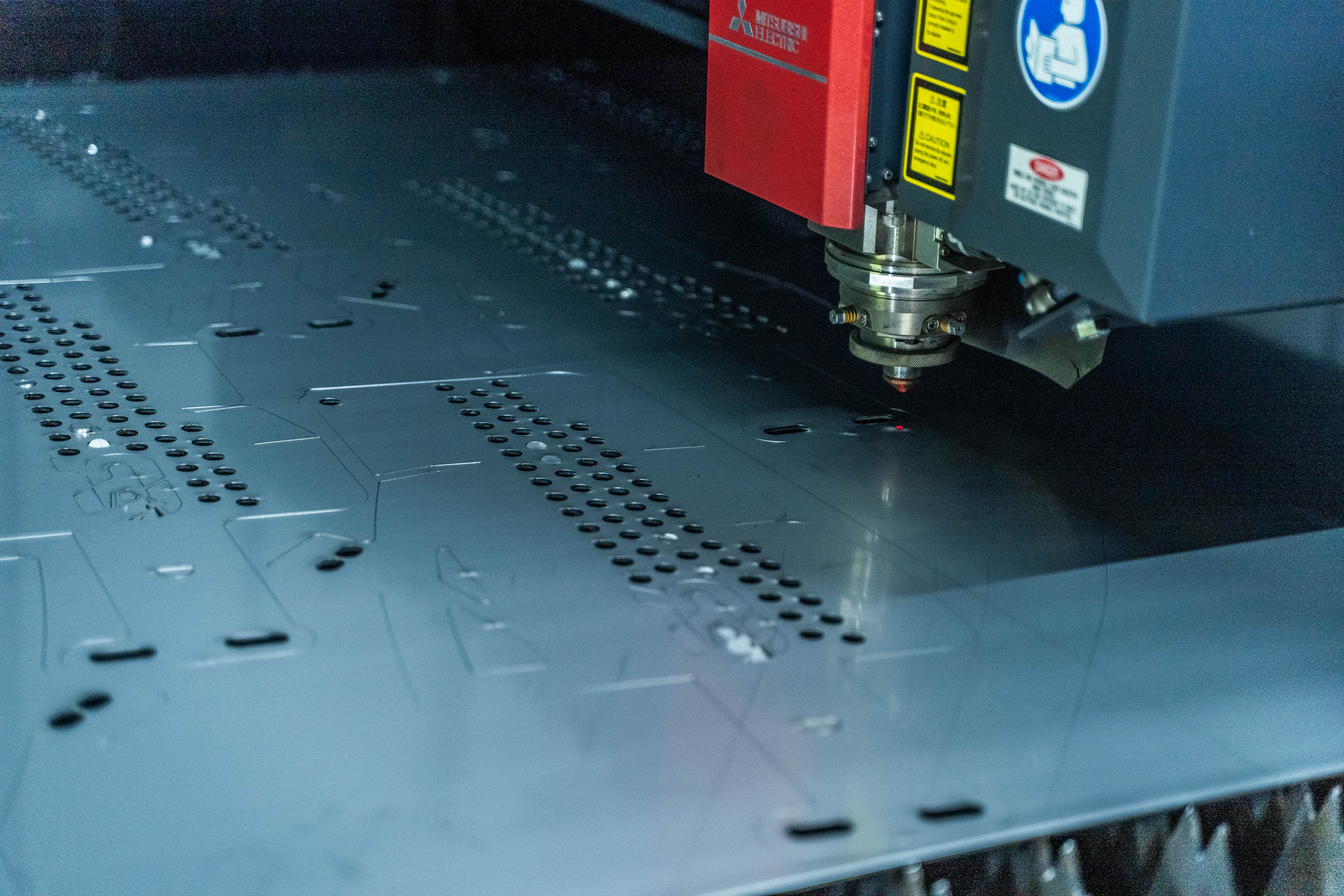 Mitsubishi 6kW fiber laser cutting machine at Apex Fabworks in operation